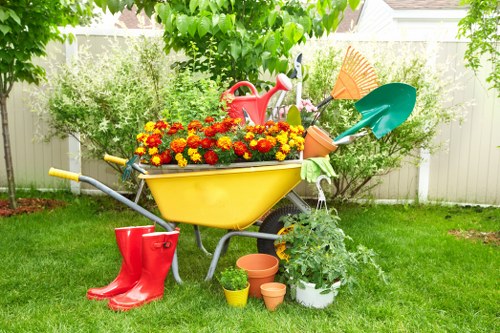 Gardener cutting grass in a Primrose Hill outdoor space